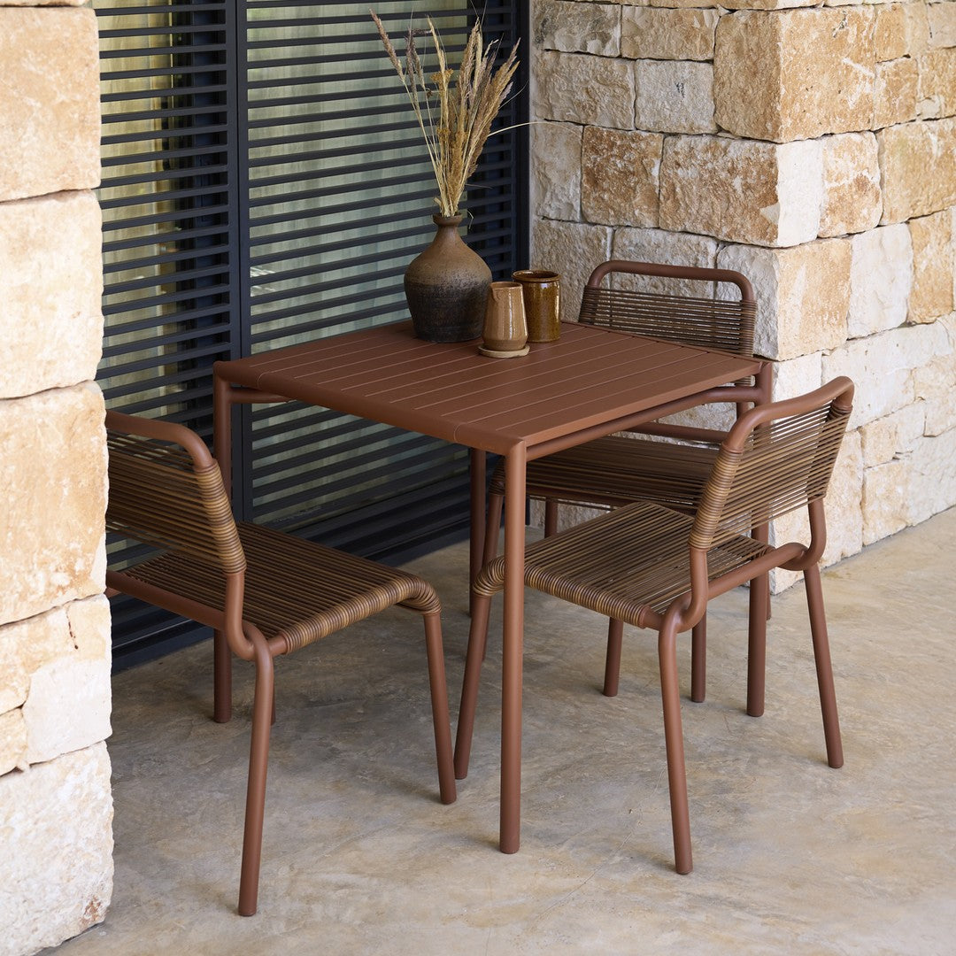 "Brown striped table and chairs set, featuring earthy tones and a sleek, contemporary design."