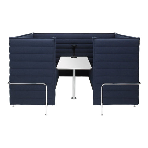 Navy blue padded booth with sleek white table and chrome legs, offering a modern, minimalist design.