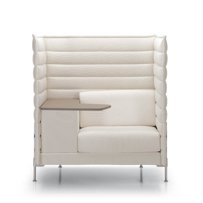 White upholstered armchair with textured, ribbed pattern and sleek, minimalist design. Ideal for modern interiors.