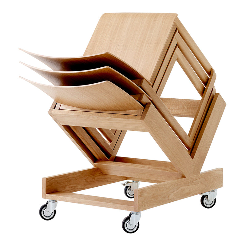 Stacked wooden chairs on wheels, featuring a light natural finish and sleek geometric design. Ideal for modern spaces.