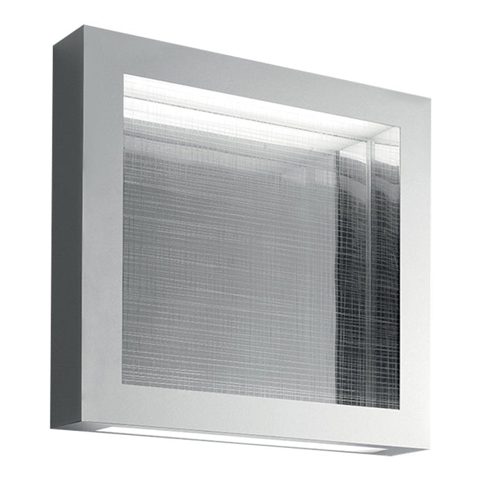 Modern silver wall sconce with textured glass panel and sleek rectangular design. Bright and stylish indoor lighting.