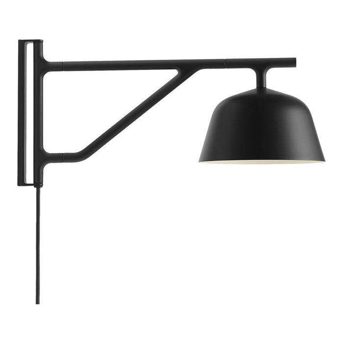 Black wall-mounted lamp with a sleek arm and a dome shade, featuring a modern, minimalist design.