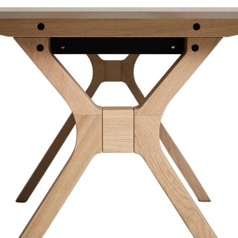 Light oak wood table base with clean lines and a minimalist design, featuring a natural finish and subtle grain patterns.