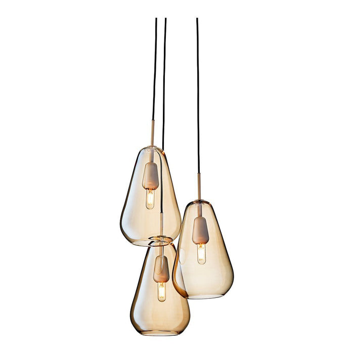 Amber glass pendant lights with a modern teardrop shape and sleek black cables. Adjustable height for versatile decor.