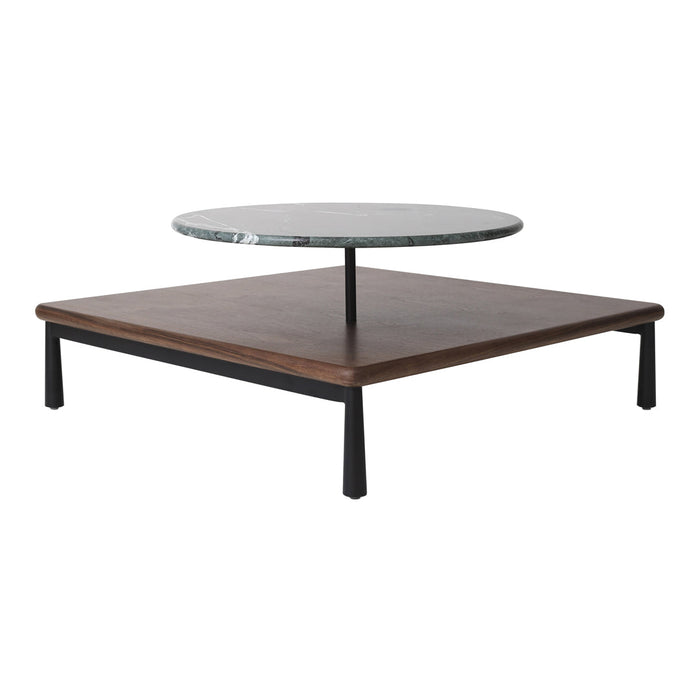 Modern round glass coffee table with a dark wooden base and sleek black metal legs, featuring a minimalistic design.