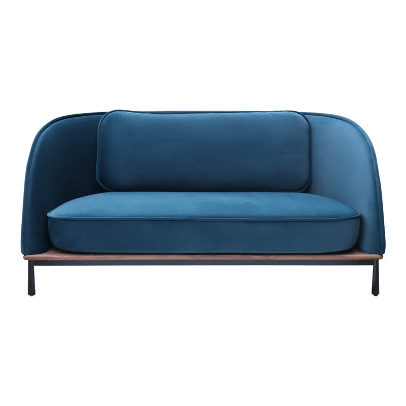 Blue velvet loveseat with smooth curves and a wooden base, adding a modern touch to any space.