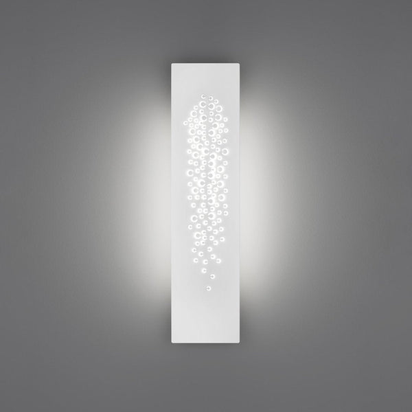 Sleek white wall sconce with a delicate pattern of cascading dots, enhancing ambient lighting against a gray background.