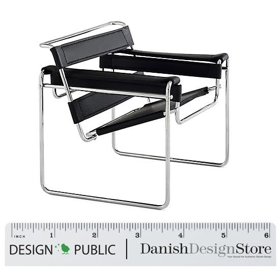 Black and chrome chair with minimalist design, featuring sleek lines and geometric patterns. Perfect for modern decor.