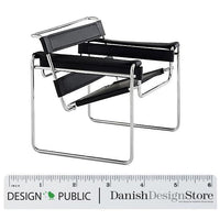 Black and chrome chair with minimalist design, featuring sleek lines and geometric patterns. Perfect for modern decor.