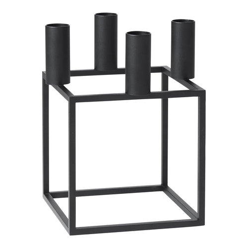 Black metal candle holder with a geometric square design and four cylindrical holders. Elegant and modern decor accent.