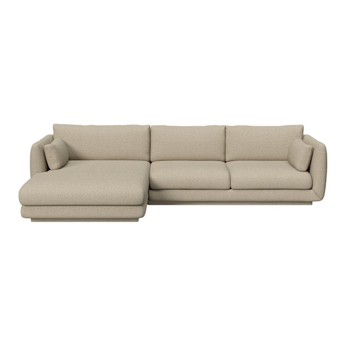 Beige sectional sofa with simple, modern lines and a smooth fabric texture, perfect for contemporary living spaces.