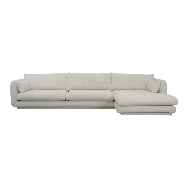 Light beige sectional sofa with a smooth, minimalist design and plush cushions. Ideal for modern living spaces.