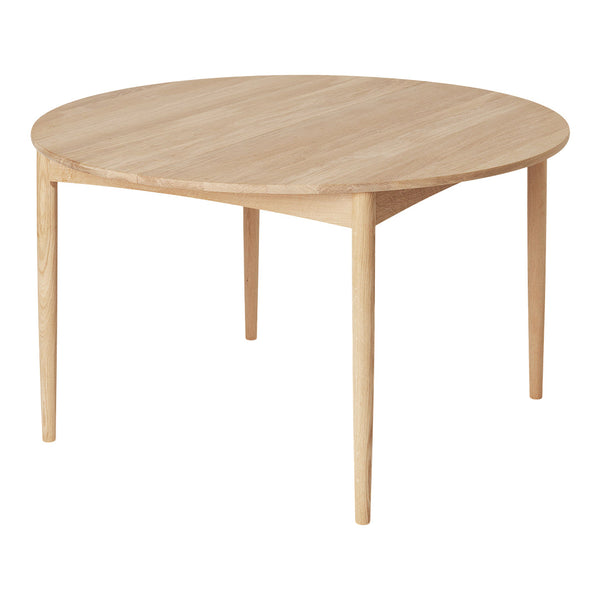 Lightwood round dining table with a smooth, natural finish and minimalistic design. Ideal for modern settings.