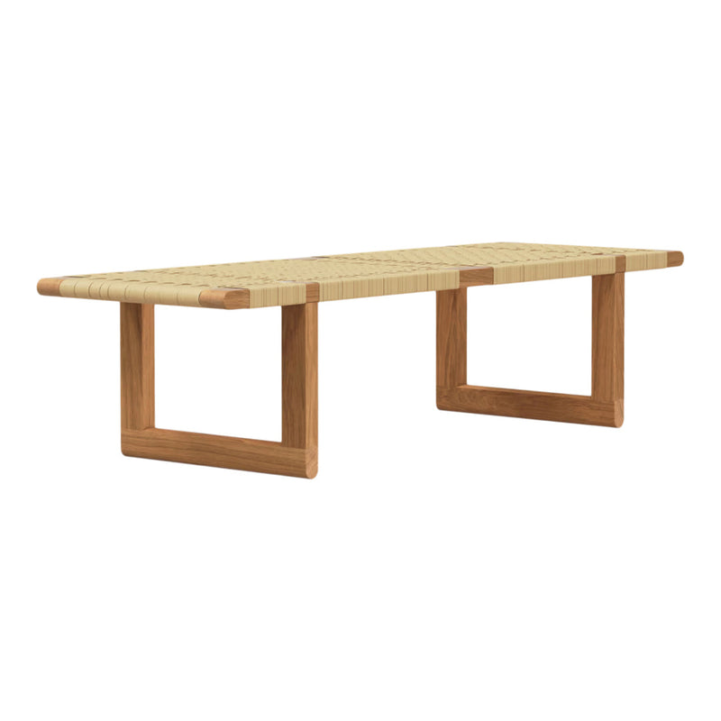 Natural wood coffee table with woven beige top and contrasting brown frame, showcasing minimalist design.
