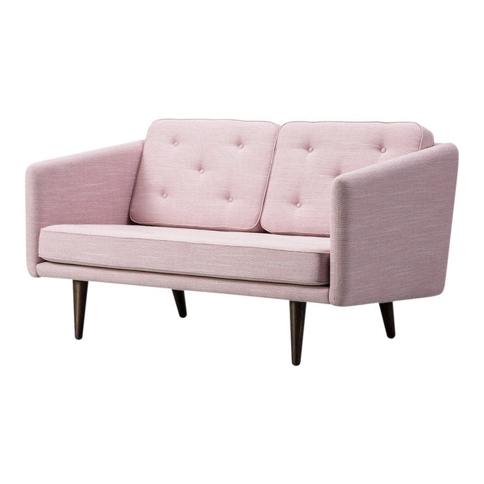 Soft pink upholstered two-seater sofa with tufted buttons and wooden legs. Modern design with a minimalist pattern.