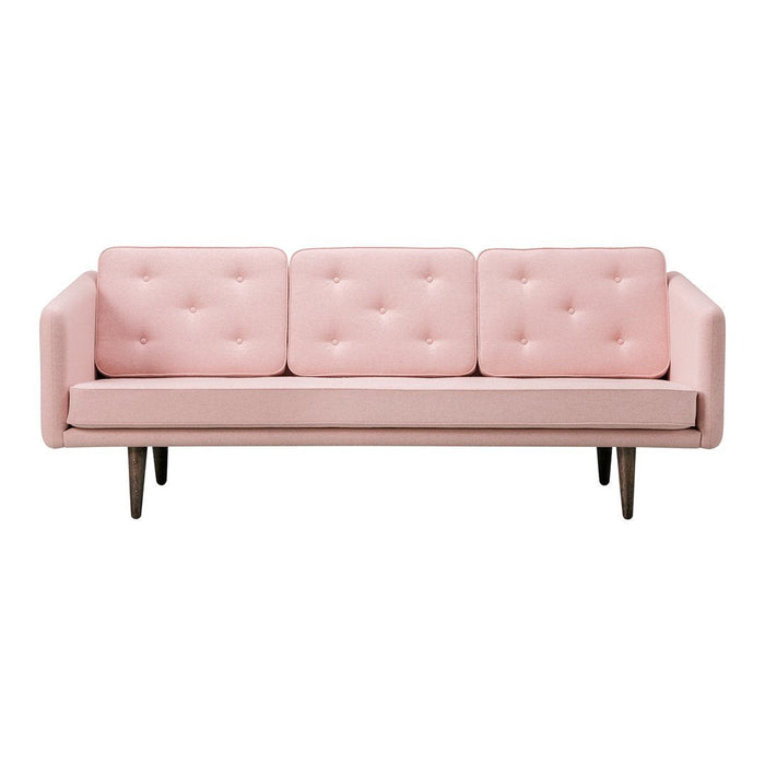Pink tufted sofa with clean lines and wooden legs, perfect for adding a touch of modern elegance to any space.