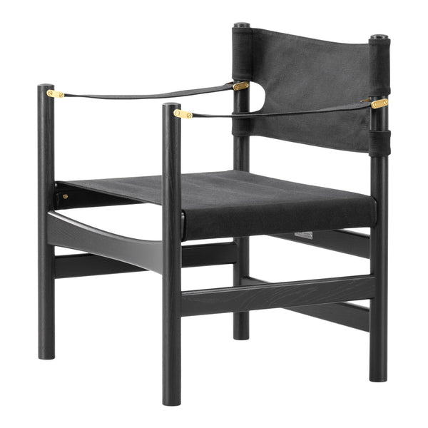 Black wooden chair with sleek lines and gold accents, featuring a modern and minimalistic design.