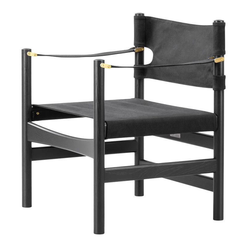 Black wooden chair with sleek lines and gold accents, featuring a modern and minimalistic design.