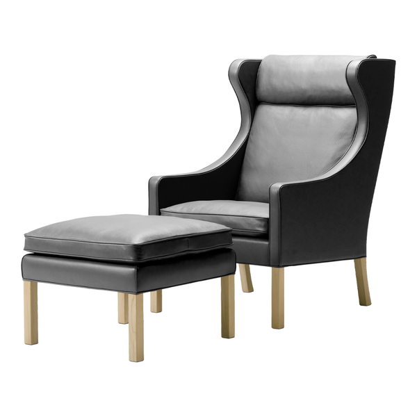 Stylish black leather armchair with matching ottoman, featuring a smooth finish and light wooden legs. Perfect for modern decor.