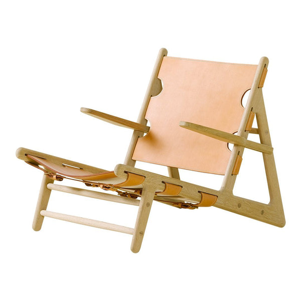 Light wood frame with tan leather seating, featuring a minimalist design and neutral color palette.