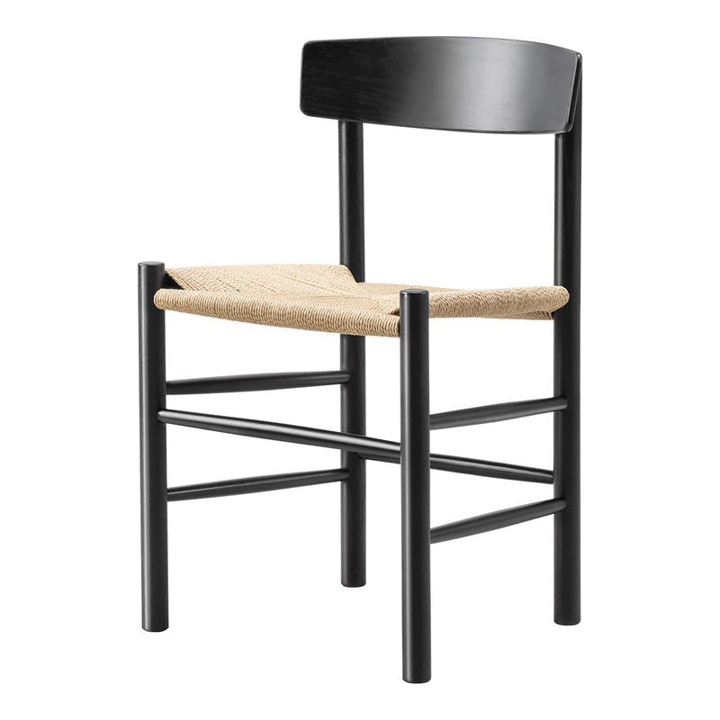 Black wooden chair with a natural woven seat, showcasing a stylish contrast of dark and light colors.