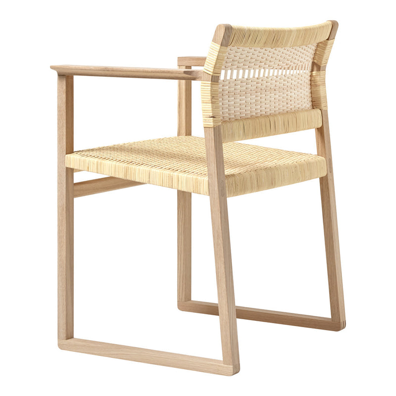 Natural wood chair with woven straw seat and backrest in a minimalist design, featuring light beige and cream tones.