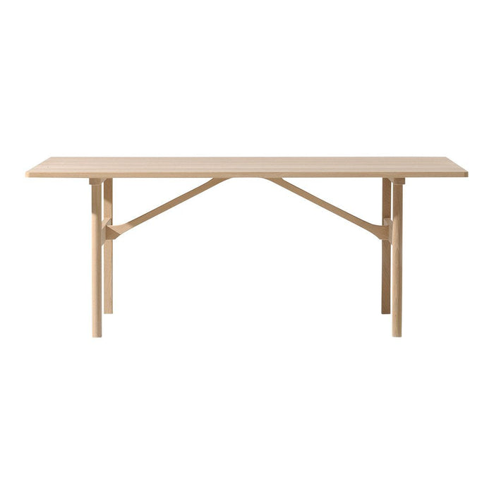 Light natural wood dining table with a smooth, minimalist design and no visible patterns. Ideal for modern decor.