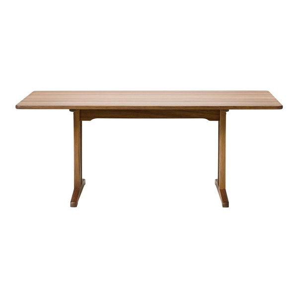 Natural wood dining table with a smooth, light oak finish and simple, modern design. Perfect for any dining space.
