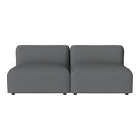 Gray modular sofa with a smooth fabric texture, featuring a minimalist design and two connected seating sections.