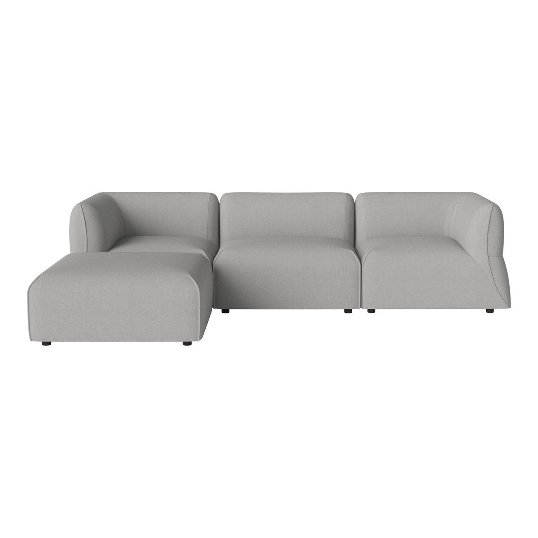 Modern gray sectional sofa with smooth, minimalist design and soft fabric finish, perfect for contemporary interiors.