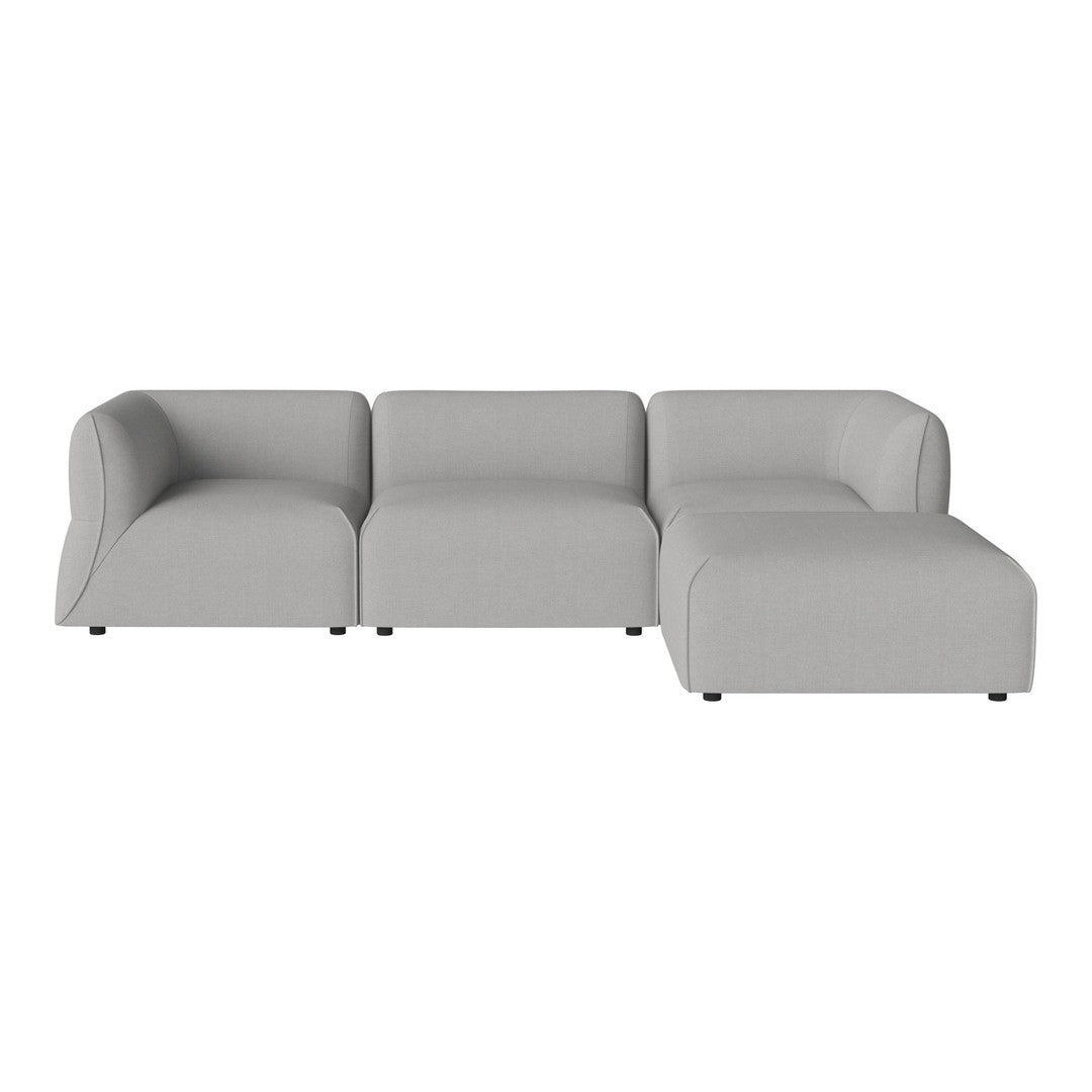 Modern grey sectional sofa with curved edges and a minimalist design, perfect for stylish living spaces.