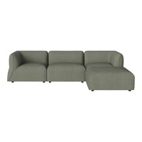 Contemporary sectional sofa in soft green upholstery with a smooth texture and minimalist design.