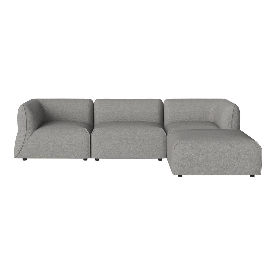 "Modern grey sectional sofa with clean lines and soft fabric, perfect for contemporary living spaces."