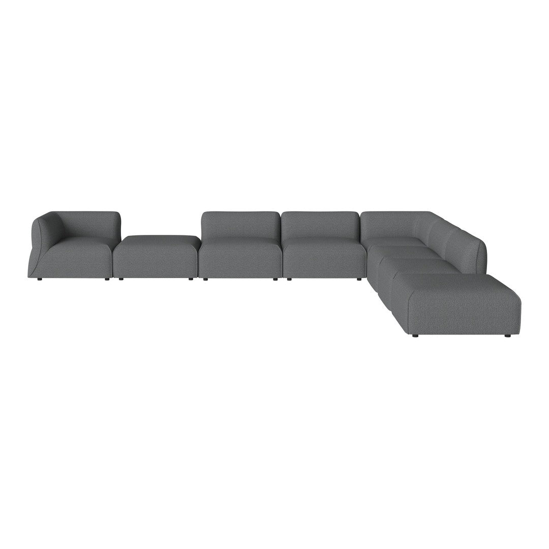 Stylish gray sectional sofa with a modern design and smooth texture, perfect for contemporary living spaces.