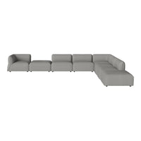 "Modern gray sectional sofa with clean lines and a minimalist silhouette, perfect for contemporary living spaces."