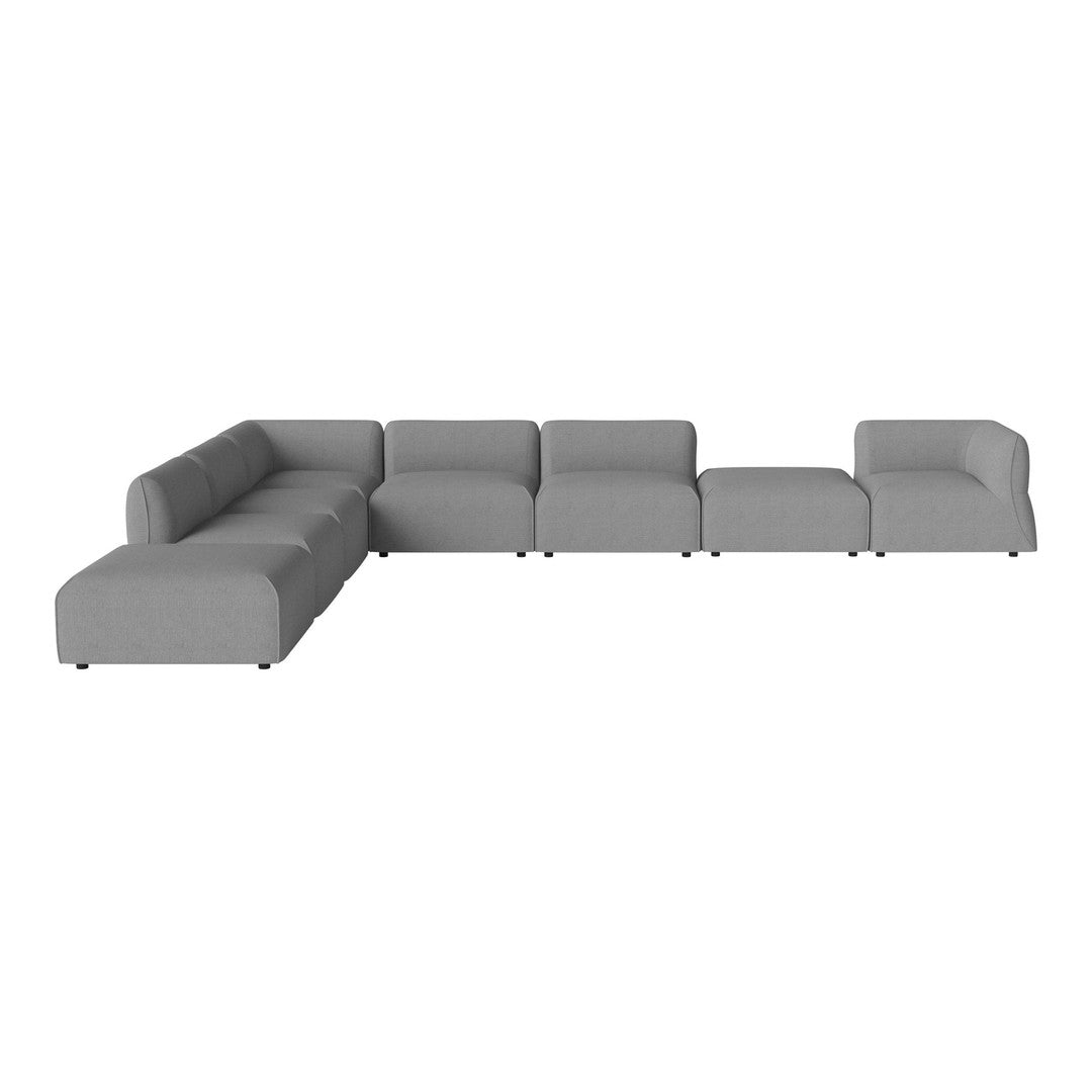 Gray modular sectional sofa with smooth fabric, featuring a minimalist design and modern, sleek lines.