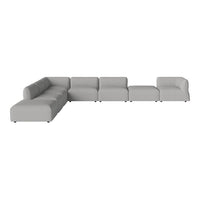 Modern L-shaped sofa in light gray fabric with a minimalist design and clean lines.