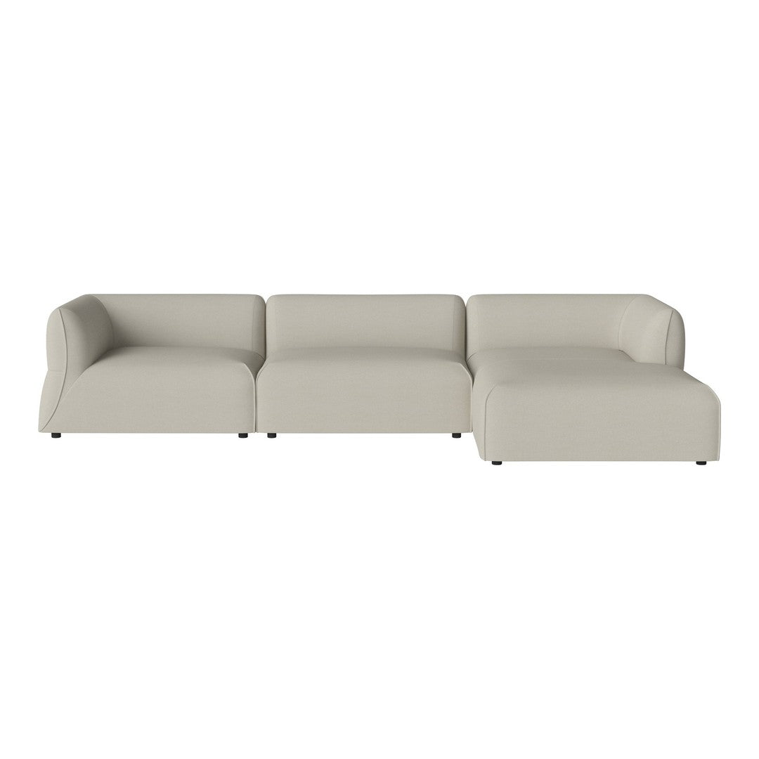 Beige sectional sofa with smooth upholstery and a minimalist design. Ideal for modern and neutral decor styles.