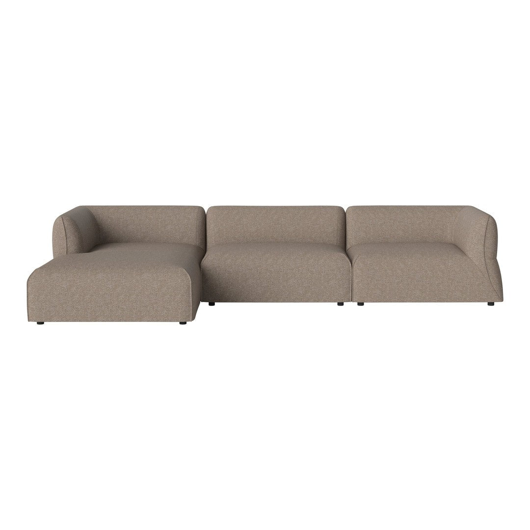 L-shaped couch in a soft beige fabric, featuring a smooth, modern design with no visible patterns.