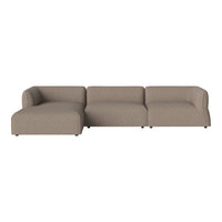 L-shaped couch in a soft beige fabric, featuring a smooth, modern design with no visible patterns.