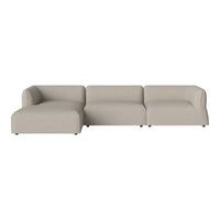 Beige sectional sofa with a smooth, solid fabric pattern and rounded edges, perfect for modern living rooms.