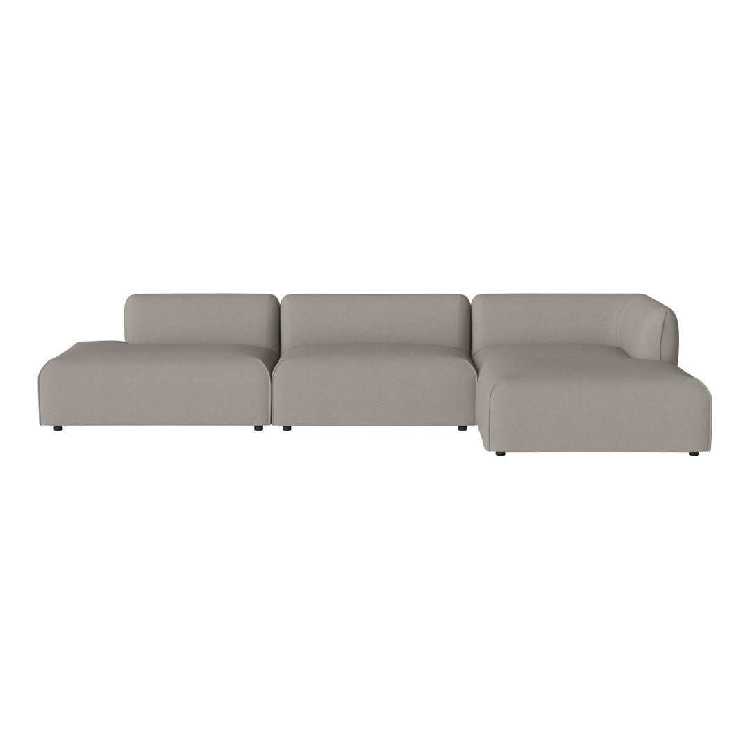 Gray sectional sofa with a smooth, minimalist design and soft fabric for modern interiors.