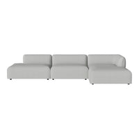 Light gray modular sofa with a smooth, minimalist design, featuring clean lines and no visible patterns.