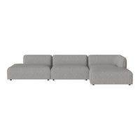 Gray sectional sofa with a smooth, textured pattern. Modern and minimalist design for contemporary living spaces.