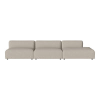 Beige sofa with a minimalist design and smooth texture, featuring clean lines and no visible patterns.
