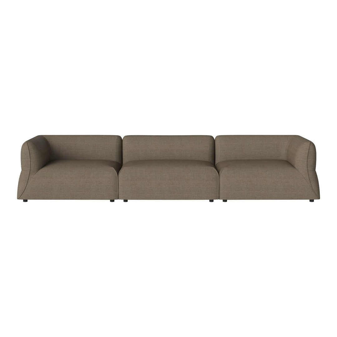 "Modern three-seat sofa in a warm taupe color with a textured fabric pattern."