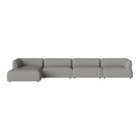 Modern sectional sofa in soft gray upholstery with clean lines and minimalistic design.