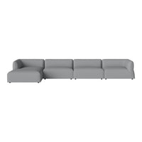 "Modern sectional sofa in soft gray fabric, featuring clean lines and a minimalist design."