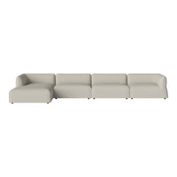 Light beige sectional sofa with smooth upholstery and minimalist design. Ideal for modern living spaces.