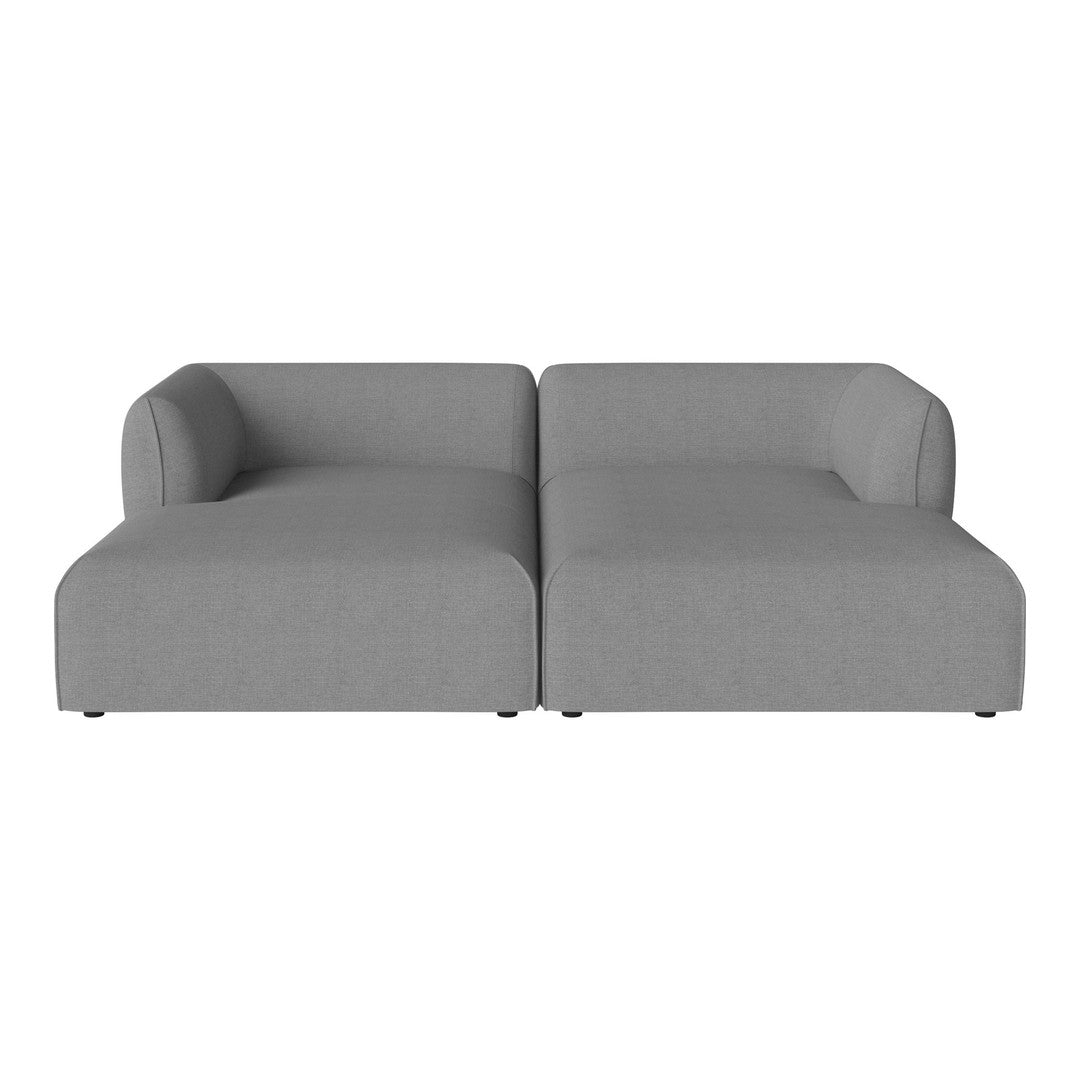 Gray sectional sofa with a minimalist design and smooth texture, ideal for modern living spaces.